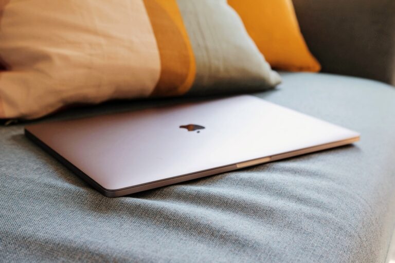 macbook air on gray textile